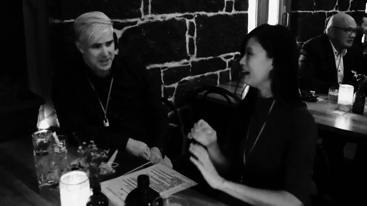 Two guests in deep conversation during the 36 Questions