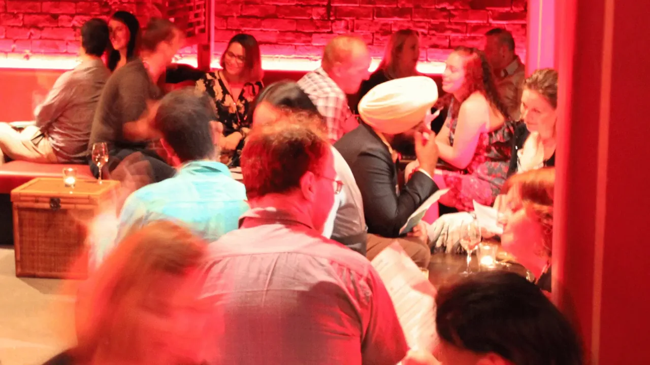 A lively room of singles connecting