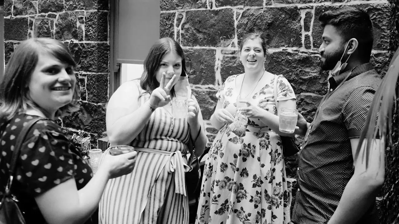 Friends raising their glasses together