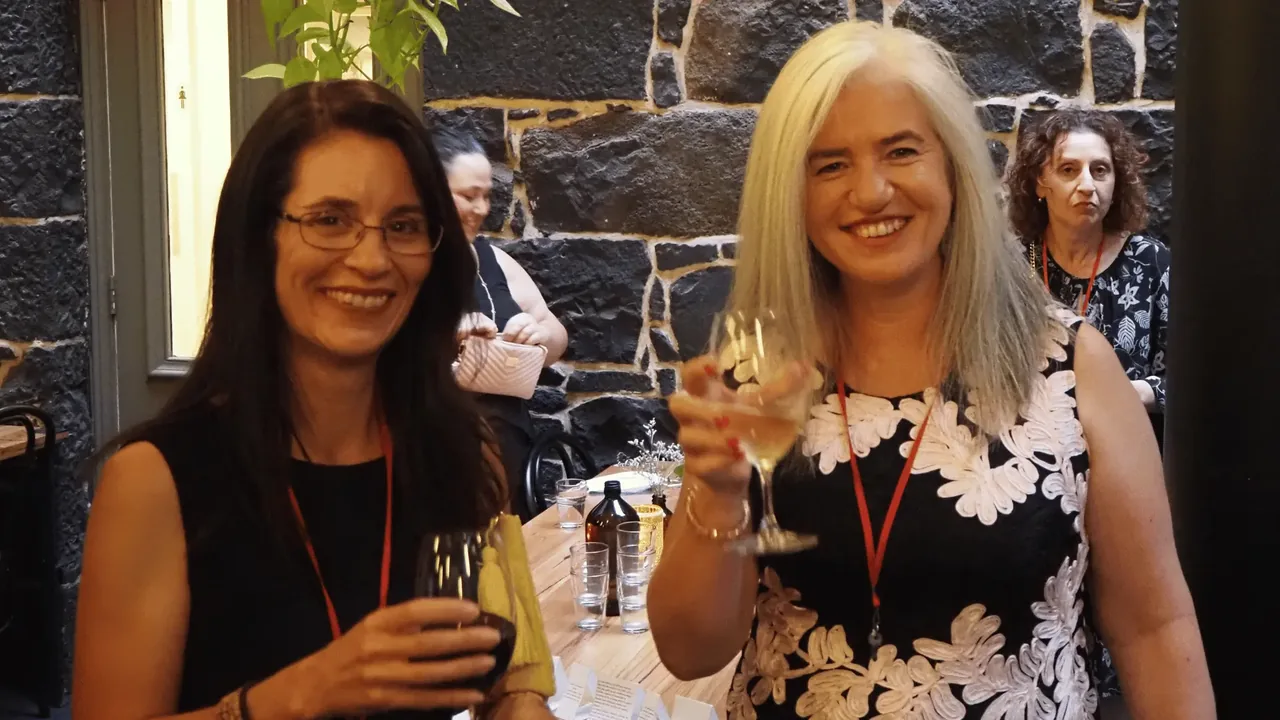Two guests raising a toast together